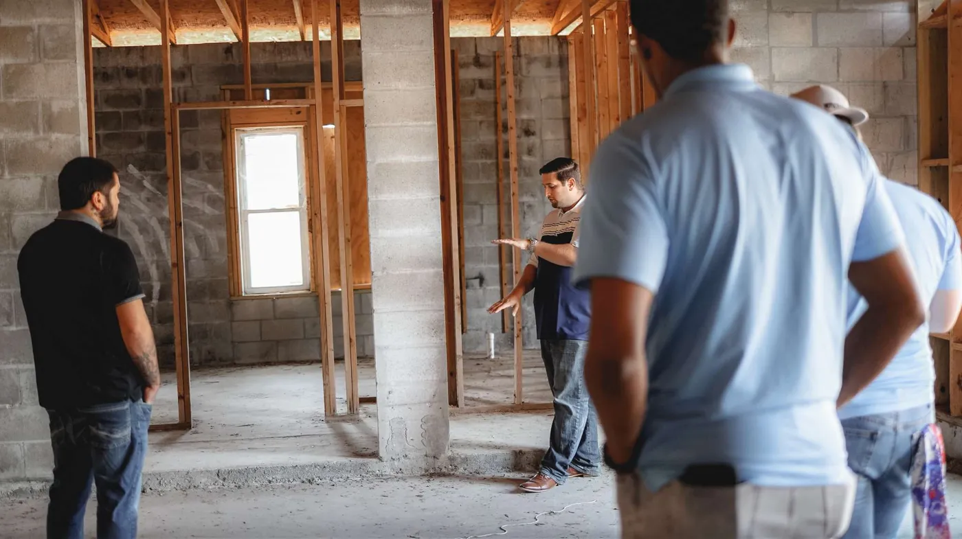 The HDS team walking a renovation site with clients